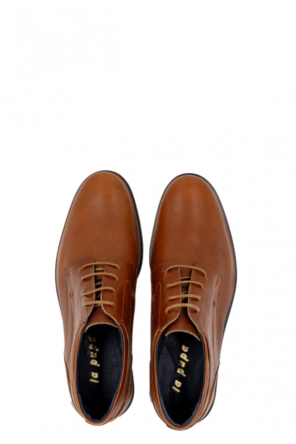 Man’s brown shoes.