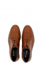 Man’s brown shoes.