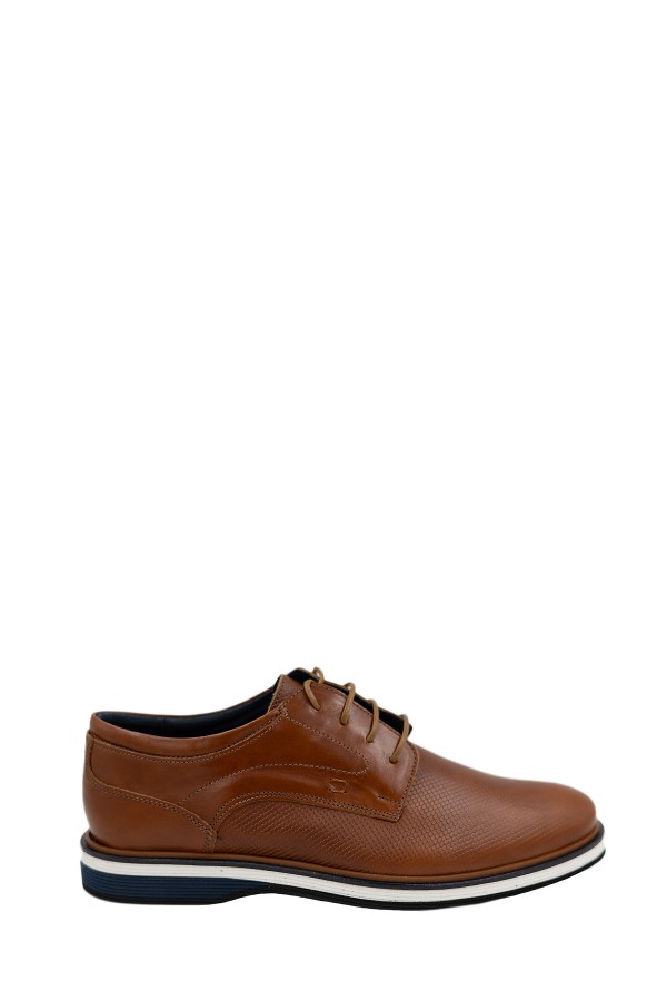 Man’s brown shoes.