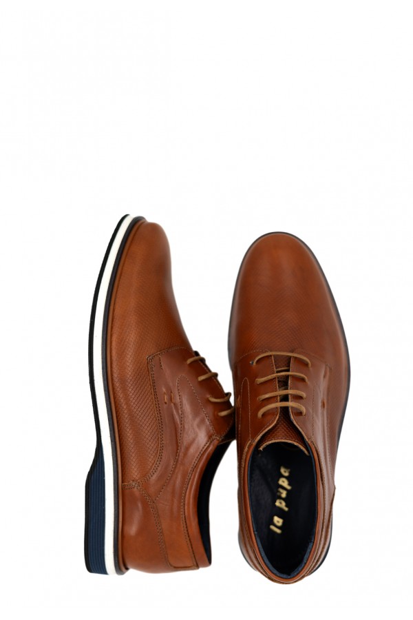 Man’s brown shoes.